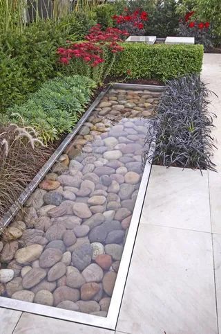 A Tranquil Oasis: A Petite Garden Featuring a Fountain