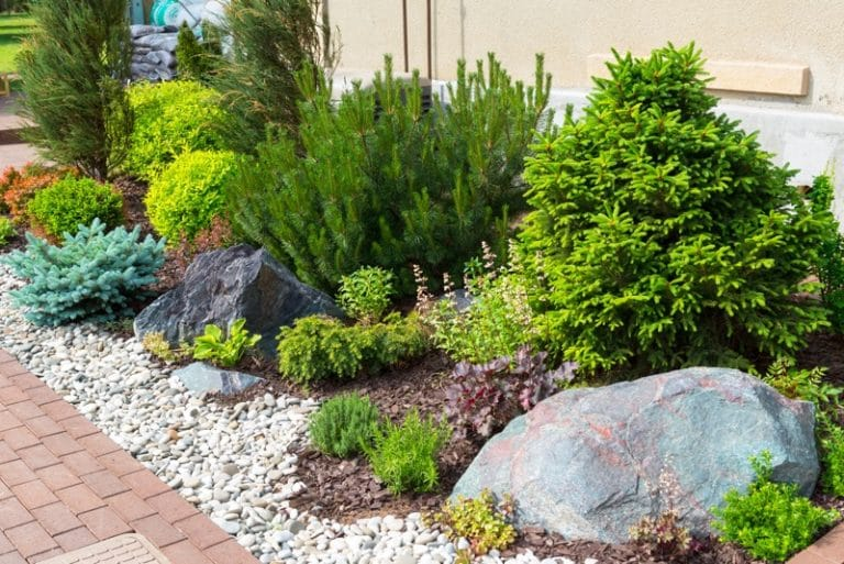 Beautifully Landscaped Flower Beds with Rocks Enhance Curb Appeal