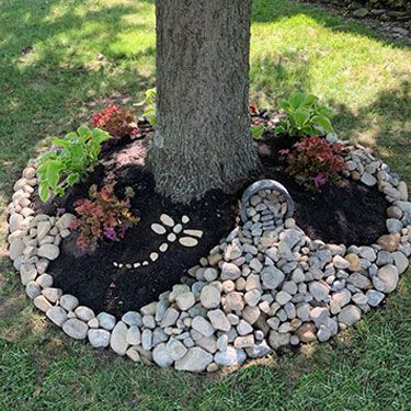 Blooms of Beauty: The Colorful array of Flowers Surrounding Tree-Lined Front Yards