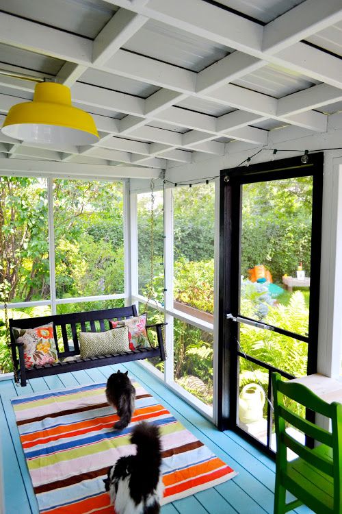 Cozy Enclosed Outdoor Space: The Charm of a Small Screened Porch