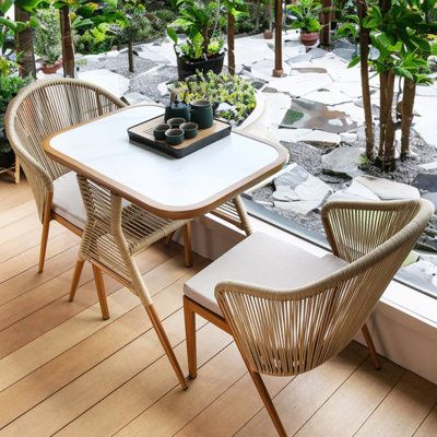 Create a Cozy Outdoor Dining Experience with a Charming Bistro Set