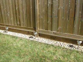 simple backyard landscaping along fence