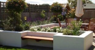 raised flower beds in front of house