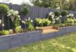 raised flower beds in front of house