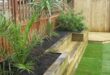 raised flower beds in front of house