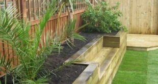 raised flower beds in front of house