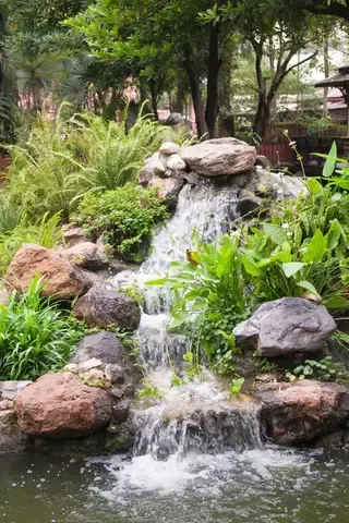 Enhance Your Outdoor Oasis with Charming Garden Waterfalls