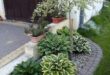 flower beds in front of house with rocks