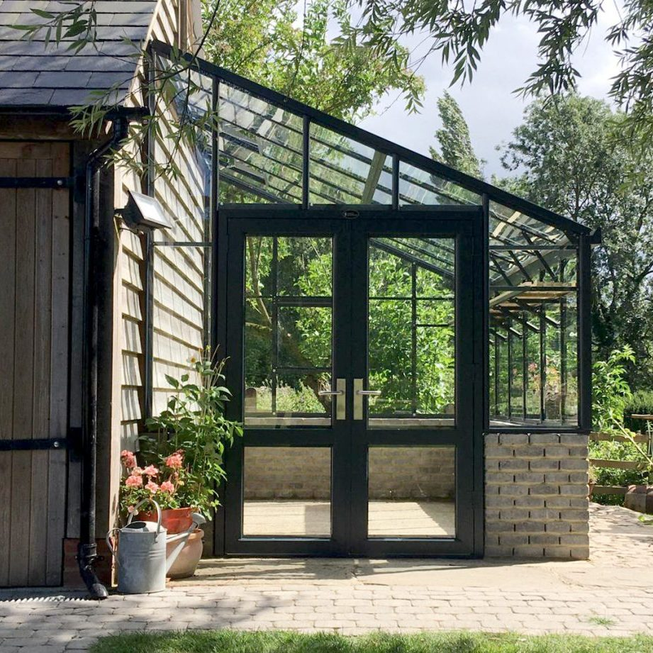 Growing a Green Thumb: The Beauty of a Backyard Greenhouse