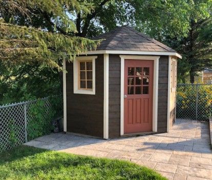 Optimal space-saving garden storage: the beauty of corner sheds