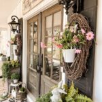 Farmhouse Porch Ideas for Spring with faux flowers and greene