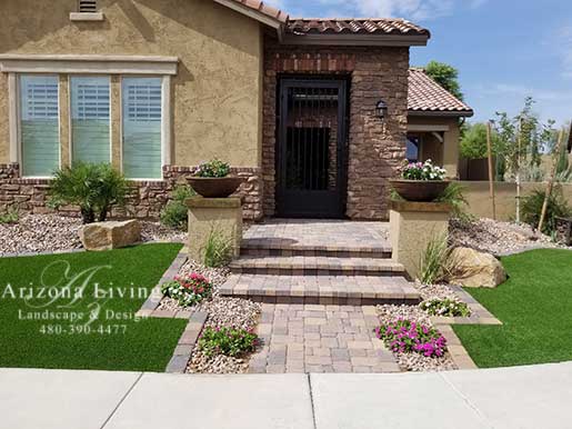 Arizona Tropical landscape design with sod, palm trees, plants .