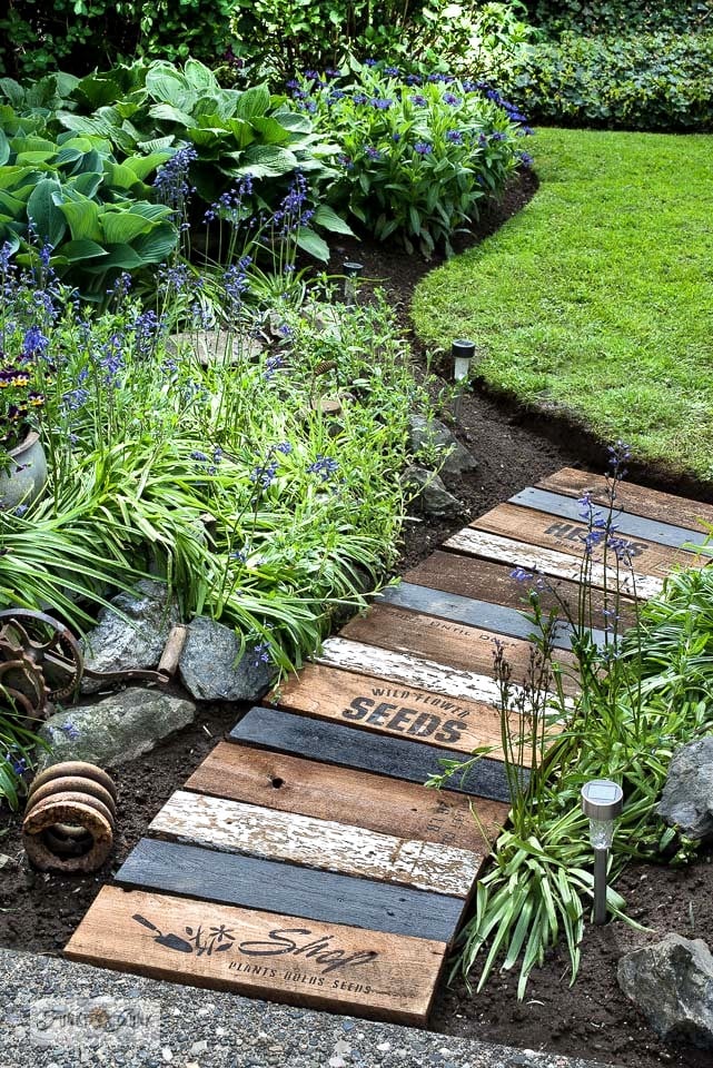 Garden walkway ideas using reclaimed wood that won't easily rot .