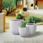 Plantara 18", 14", & 10" D Round Solid White Concrete planter (Set .