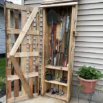 Garden tool storage cabinet made with weathered pallet planks and .