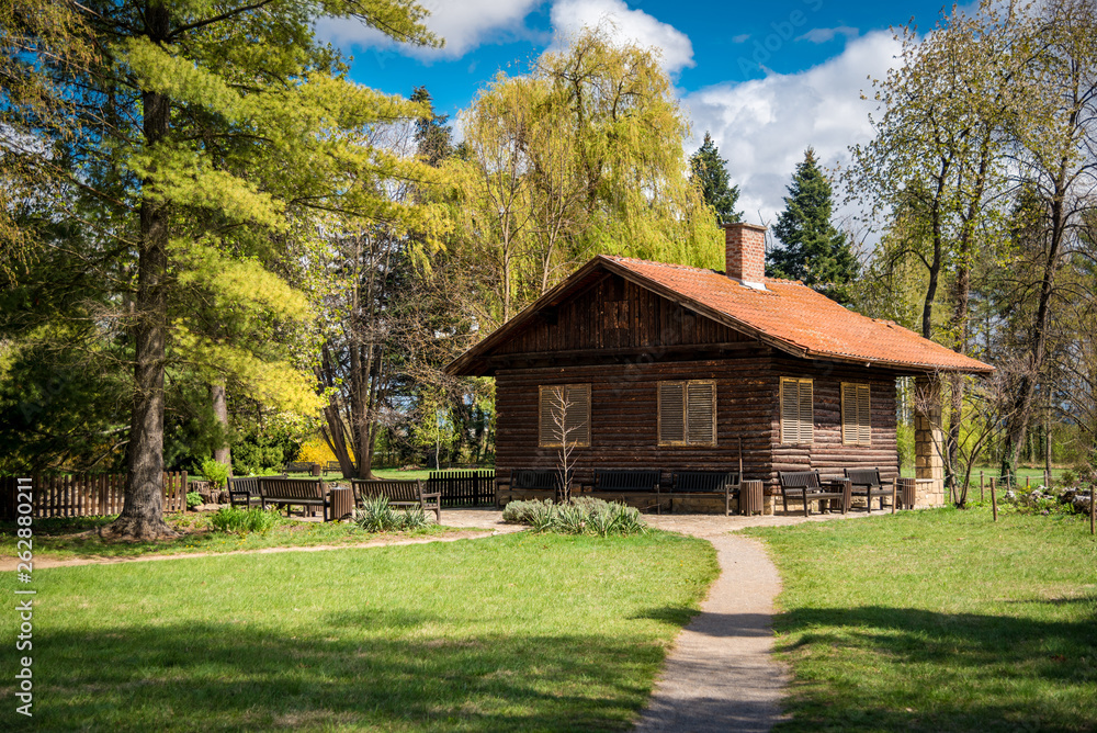 Wooden house near a forest. The park of Vrana Palace in Sofia .