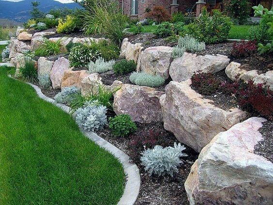 Sloped Hill Landscaping with Boulde