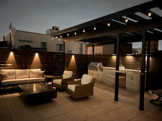 A Rooftop Deck That's On Top Of Building Co