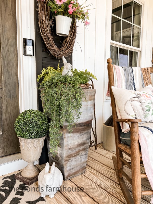 Farmhouse Porch Ideas for Spring with faux flowers and greene