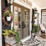 Farmhouse Porch Ideas for Spring with faux flowers and greene